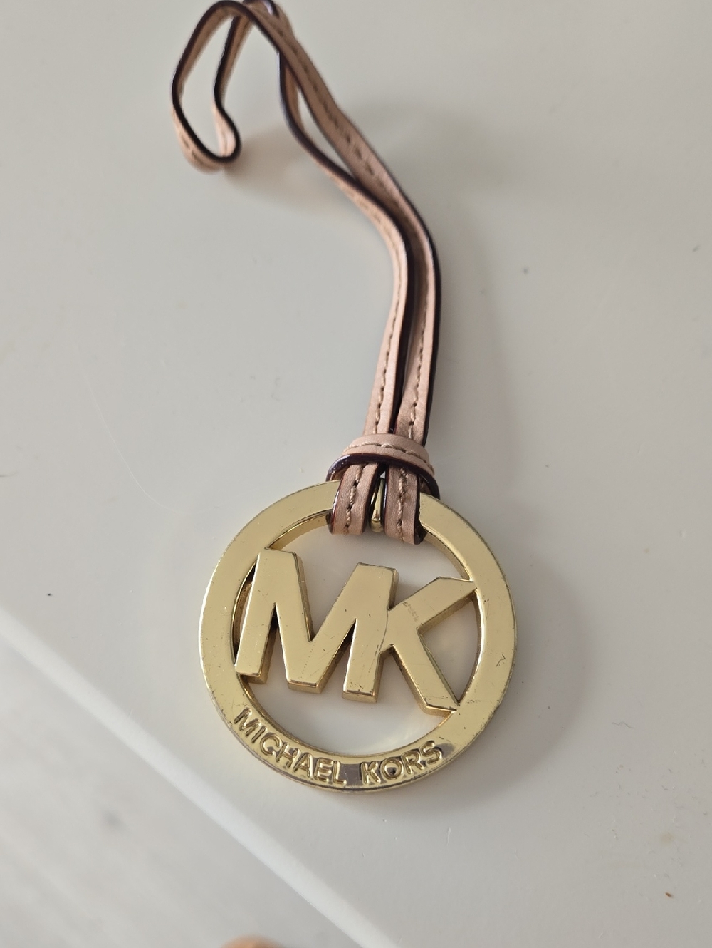 Michael Kors Gold MK Logo Pendant Beige With Gold Hardware.